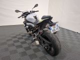 a motorcycle that is parked on a checkered floor