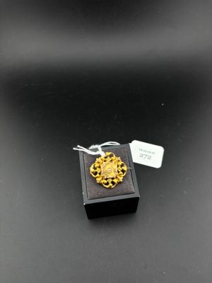 a close up of a small box on a table with a tag