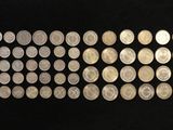 a close up of a row of coins on a black surface