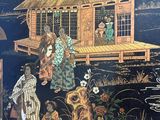 a black and gold wallpaper with a picture of people in front of a house