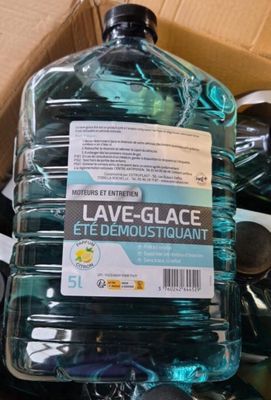 a large bottle of water sitting on top of a pile of bottles