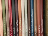 a lot of books that are sitting on a shelf