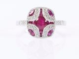 an oval ruby and diamond ring, set in 18k white gold
