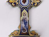 wall cross with the image of the virgin mary and jesus on it