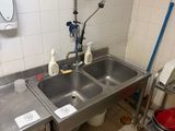 two sinks in the kitchen with a faucet and a sink