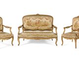 four chairs and a couch are lined up in a row