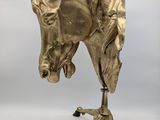 brass horse head on a tripod stand on a white background