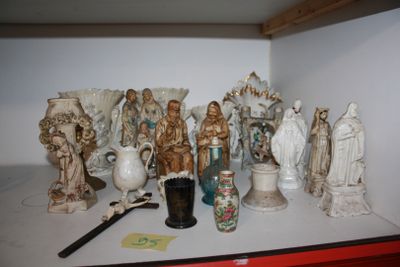 many figurines sitting on a shelf in a room