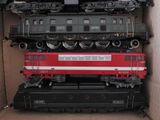 a box full of toy trains sitting on top of each other