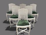 set of six white cane back chairs with green cushions