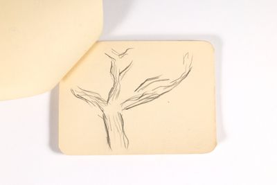 le dessin d'un arbre sur une feuille de papier