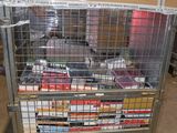 a metal cart with many items in it in a warehouse