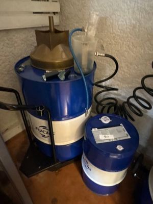 a blue drum with a brass top and a blue drum with a white stripe