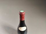 a bottle of wine that is sitting on a table