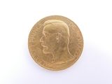 a gold coin with a picture of a man on it