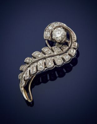 a diamond and gold broochle broochle