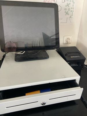 a laptop computer sitting on top of a white desk