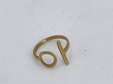 a gold ring with the letter p on it