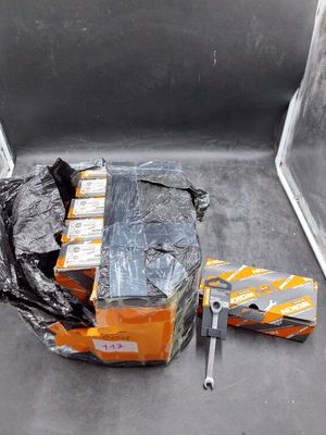 many packages of food sitting on the back of a truck