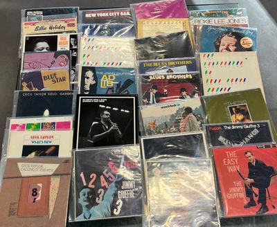 a lot of cds that are sitting on a table