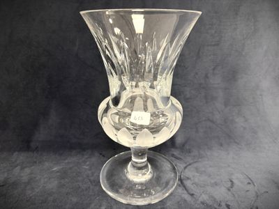 a glass vase that is sitting on a table