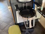 a chair that is sitting next to a stool