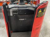 a forklift with a red cover on it in a warehouse