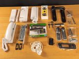 the contents of a cell phone and other electronics laid out on a table