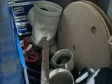 a pile of trash in a room with a toilet and other items