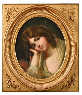 portrait d'une jeune femme dans un cadre doré