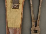pair of old tools sitting on top of a table next to each other