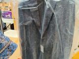 a plastic bag with a jacket on it in a room