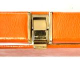 an image of an orange purse with a gold clasp on a white background