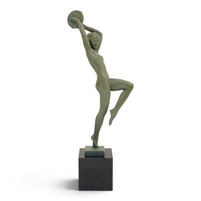 bronze statue of a woman holding a basketball ball on a marble base