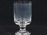 a glass that is sitting on a black surface