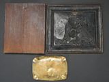 three pieces of art are displayed on a black surface