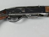 an old gun with a wooden handle on a white surface