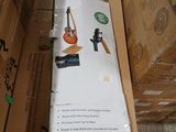 a cardboard box with a guitar in it sitting on the floor