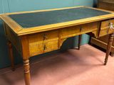 a wooden desk with a black top and two drawers