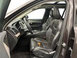the interior of a car with the door open and the driver ' s seat down