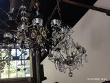 a chandelier hanging from the ceiling in a room