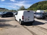 a white van that is parked in a parking lot