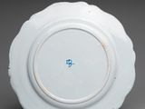 a white plate with a blue design on it