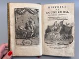 un livre ouvert sur lequel figure l'image d'un homme et d'une femme dans un lit
