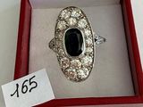 a ring in a red box with a price tag on it