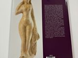 the back cover of a book with a statue of a woman on it