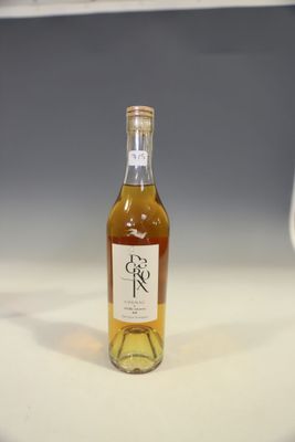 a bottle of wine that is sitting on a counter
