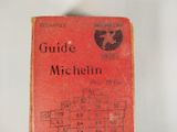 a red book with numbers on it sitting on a table