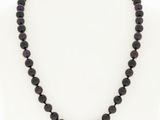 a black beaded necklace on a mannequin mannequin mannequin mannequin mannequin mannequin mannequin mannequin mann