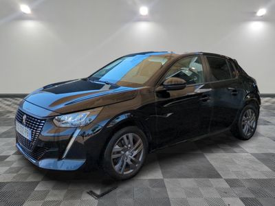a black and blue car is parked on a checkered floor